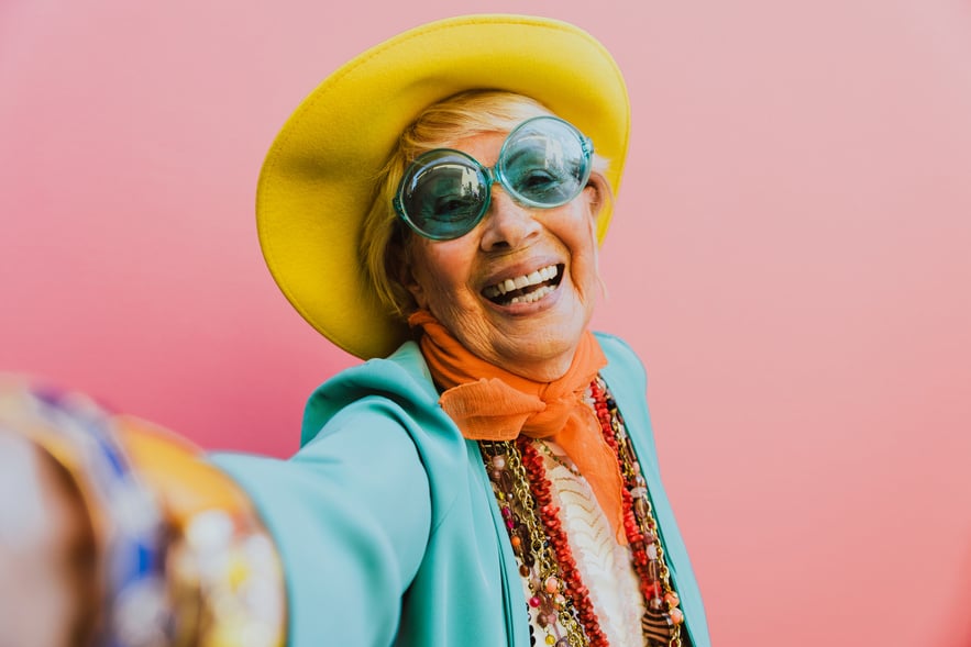 Happy Grandmother Posing on Colored Backgrounds